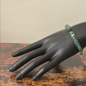 Joan Boyce Green Rhinestone and Gild Tone Hinged Bangle Bracelet